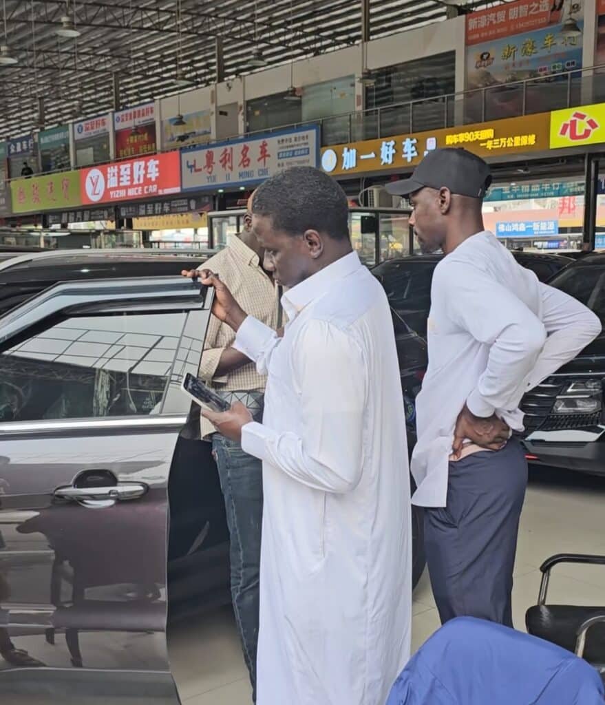 Overseas buyers discussing vehicle export supply and cooperation