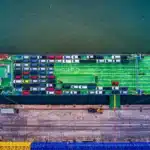 Aerial view of a car transport ship docked at Bekasi port, Indonesia.